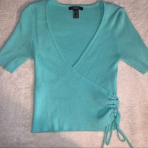 Turquoise cross-over drawstring side blouse